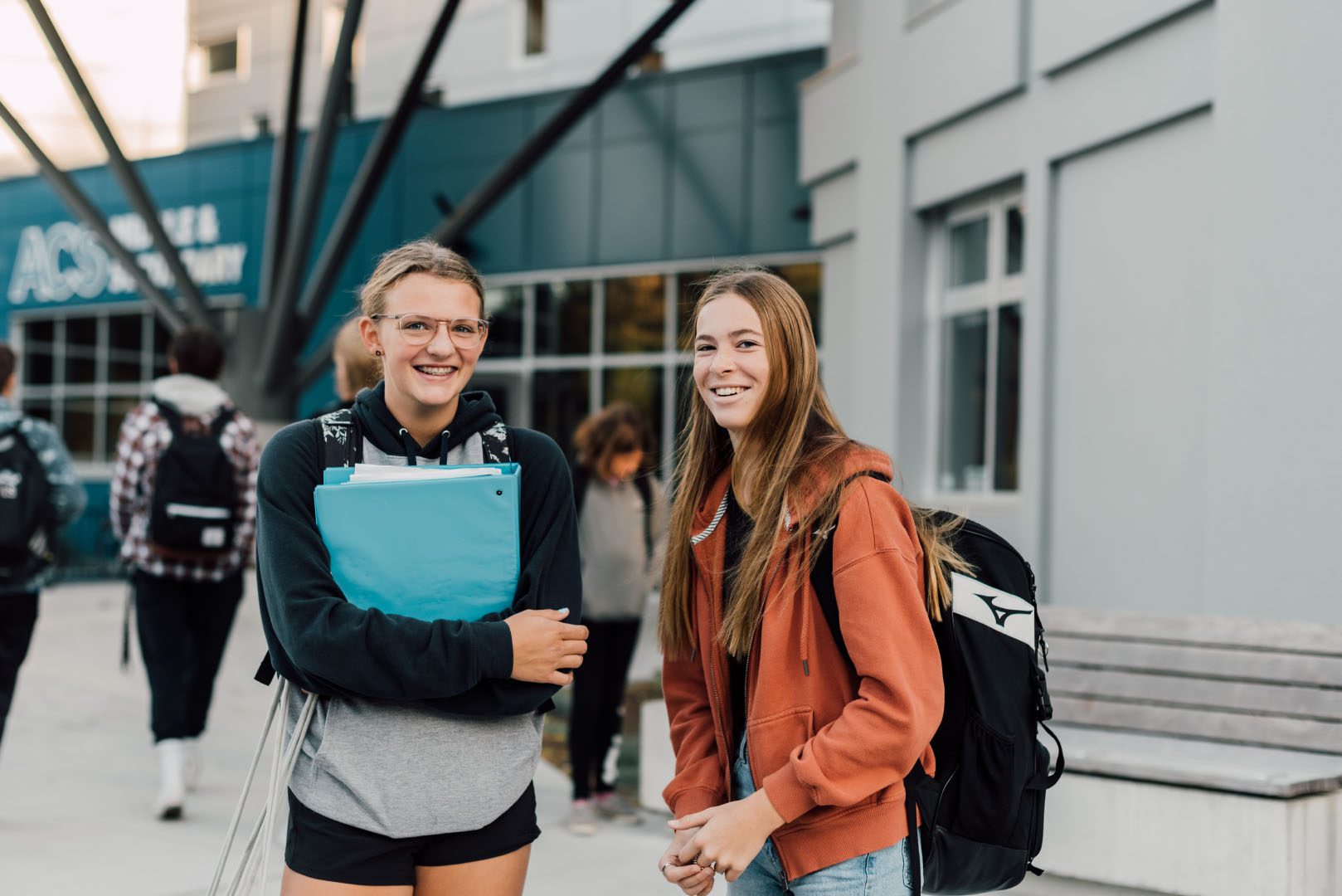 Two female secondary students stand outside Abbotsford Christian School